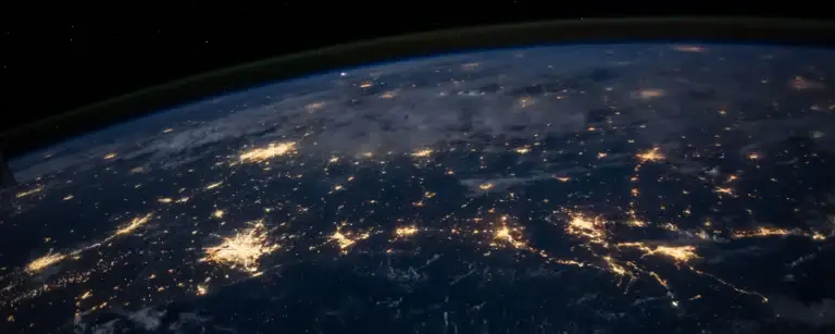 Earth at night with glowing connections representing an organisation's global attack surface