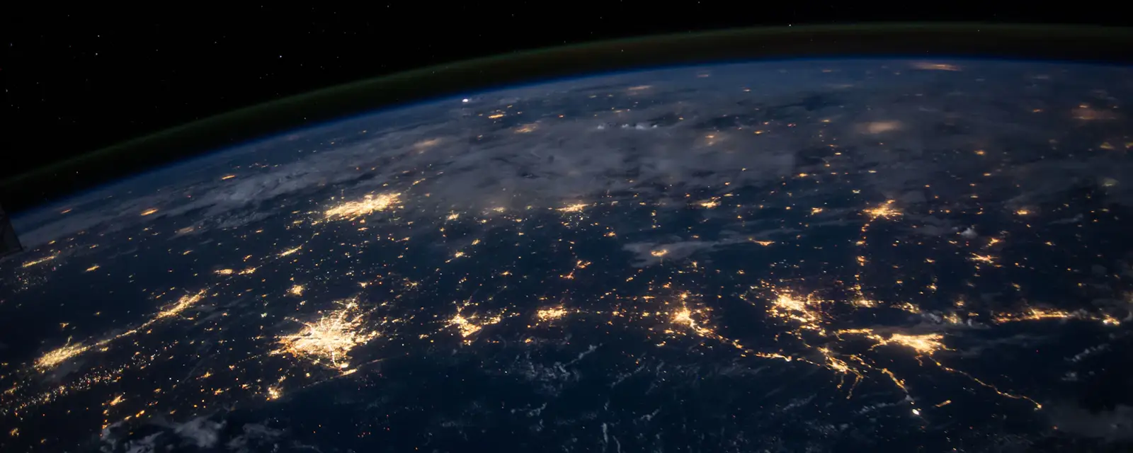 Earth at night with glowing connections representing an organisation's global attack surface