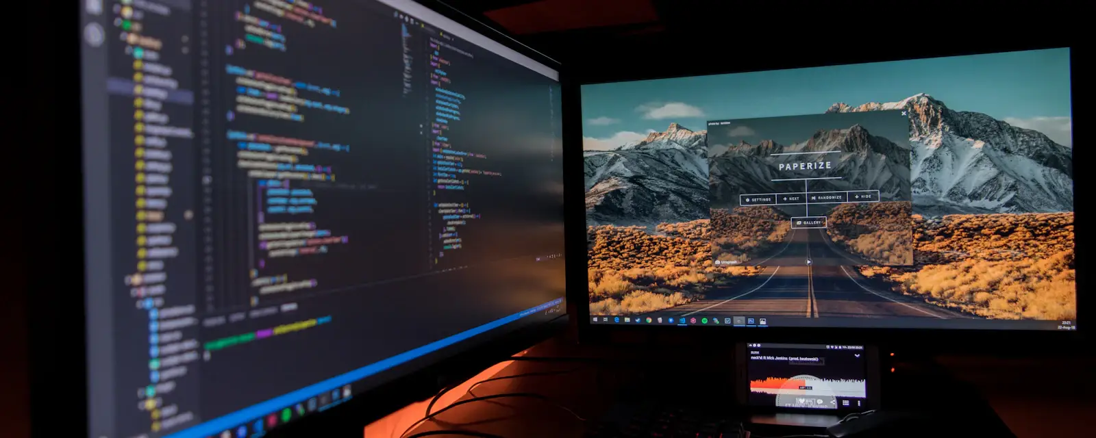 Dual monitors running development and monitoring tools for continuous security testing